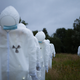 Illustration for article titled Horde of 100 radiation suit-clad specters invades German music festival